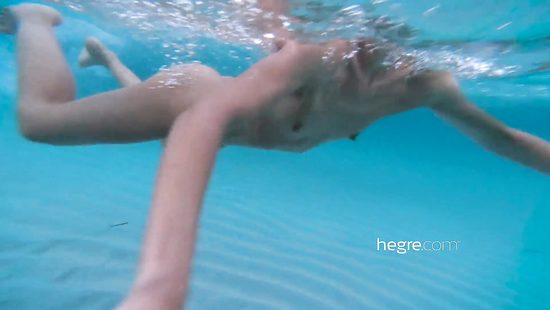 Skinny girl poses naked outdoors