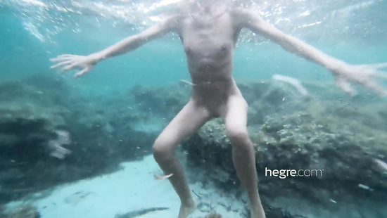 Skinny girl poses naked outdoors