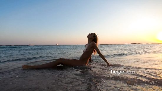 Skinny girl poses naked outdoors