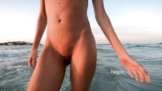 Skinny girl poses naked outdoors