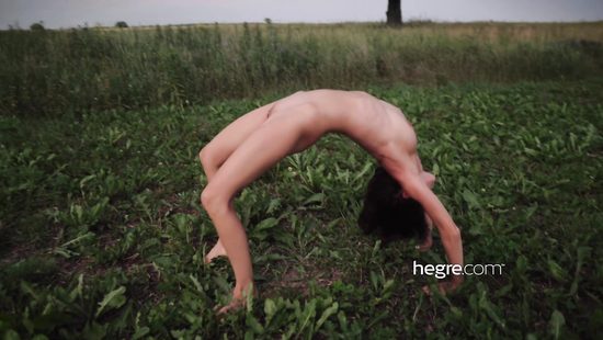 Uliana poses naked outdoors