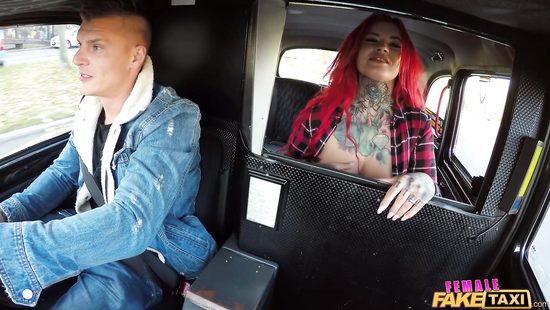 Busty redhead pounded in a tight car space