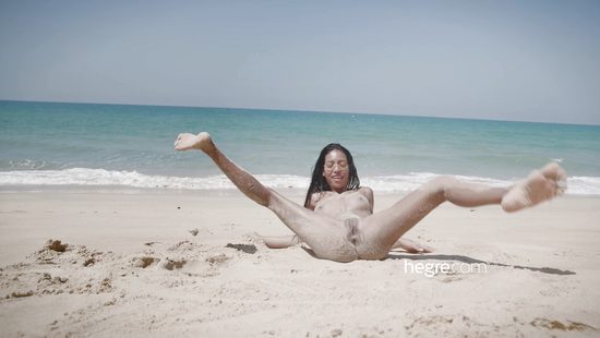 Outdoor fun at the beach for a thin hon