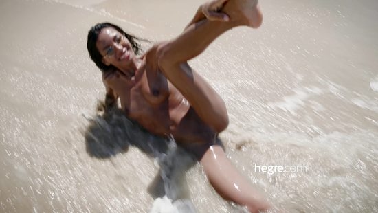 Outdoor fun at the beach for a thin hon