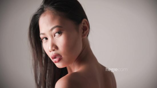 Fine Asian strips nude in sensual pose