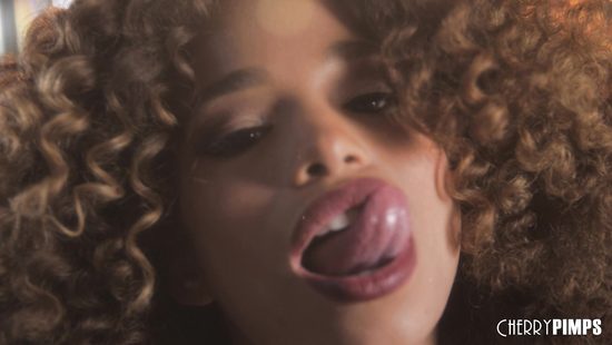 Curly-haired babe fingers dripping wet twat