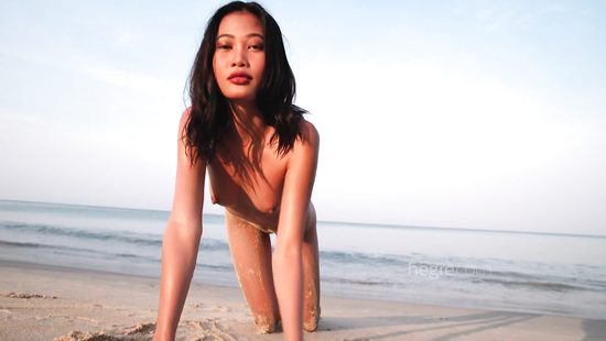 Small-tittied Asian babe poses on the beach