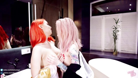 Lesbians are lovemaking in bathroom