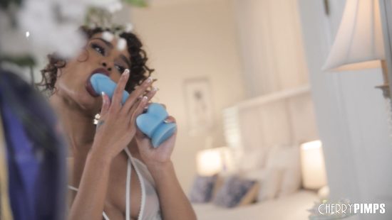 Spicy ebony rides a dildo