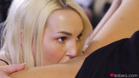 Blonde and brunette are licking