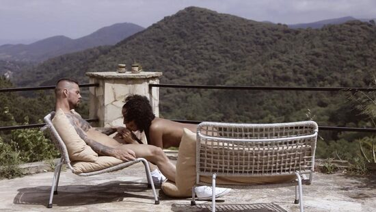 A tender act of love with a beautiful view of the mountains