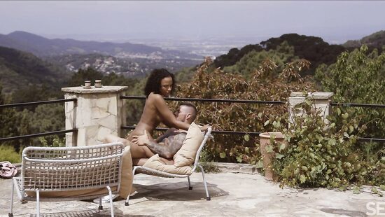 A tender act of love with a beautiful view of the mountains