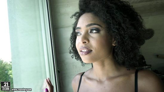 Curly ebony devours white meat