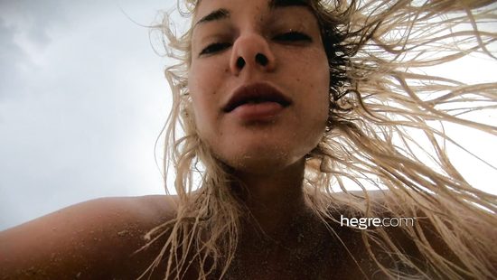 Naked Russian bitch stuffs anal with a plug