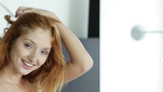 Redhead feels energized when posing hot