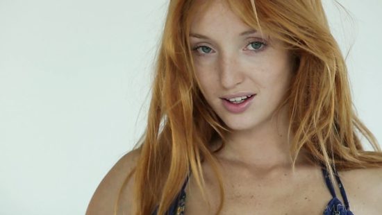 Redhead feels energized when posing hot