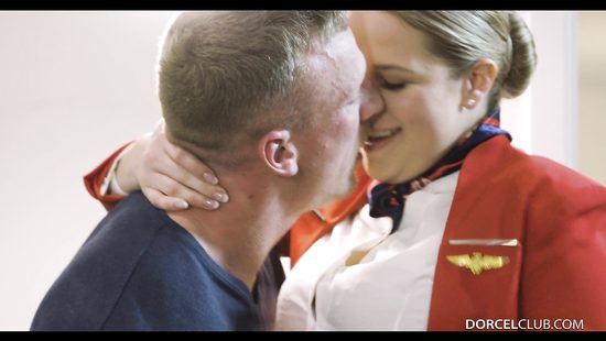 Stewardess in a uniform wanks a cock and gets nailed