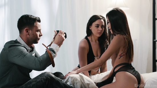 Cameraman goes for two pussies in a threesome scene